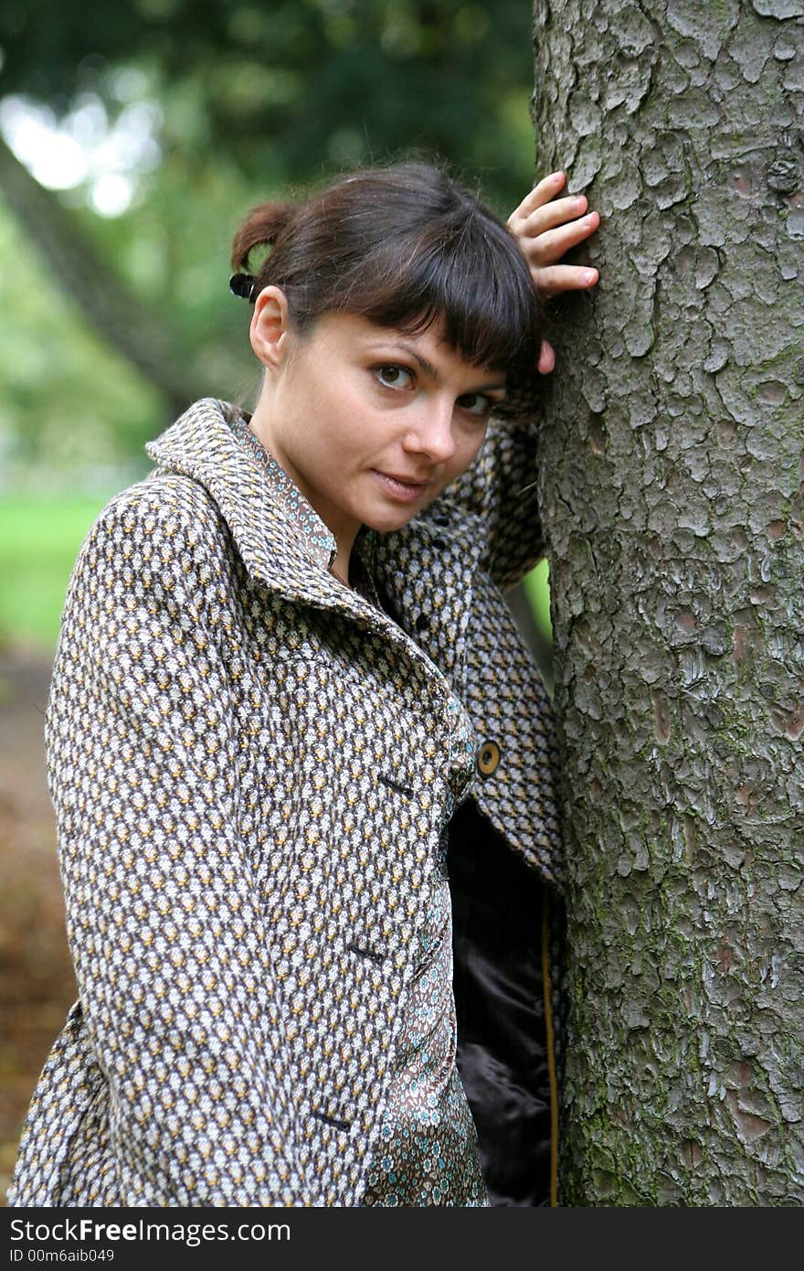 Beautiful woman walking in the autumn park. Beautiful woman walking in the autumn park