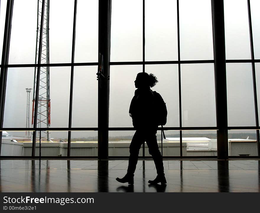 Traveller at an airport, walking to next gate