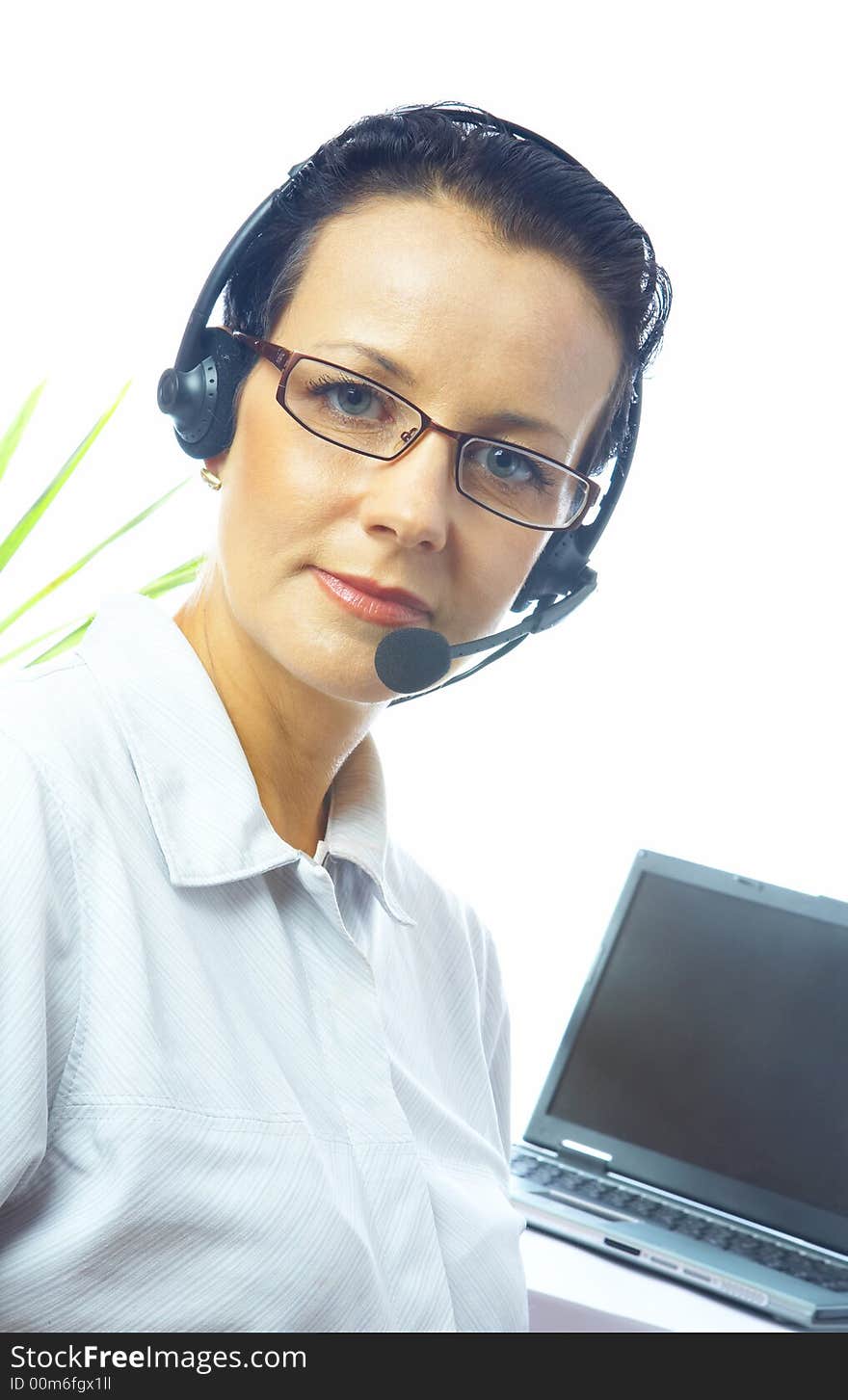 View of nice operator in stylish glasses at her working place. View of nice operator in stylish glasses at her working place