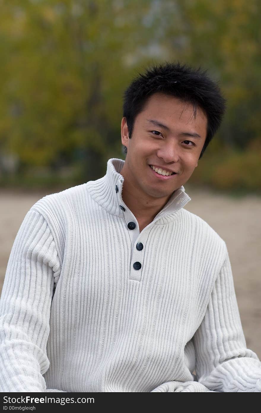 A boy standing on the woodbine beach wearing sports clothing. A boy standing on the woodbine beach wearing sports clothing