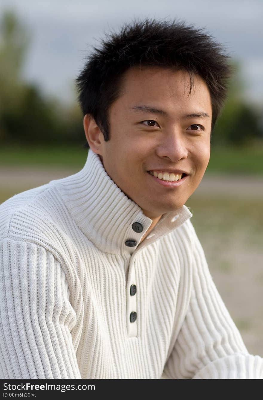 A boy standing on the woodbine beach wearing sports clothing. A boy standing on the woodbine beach wearing sports clothing