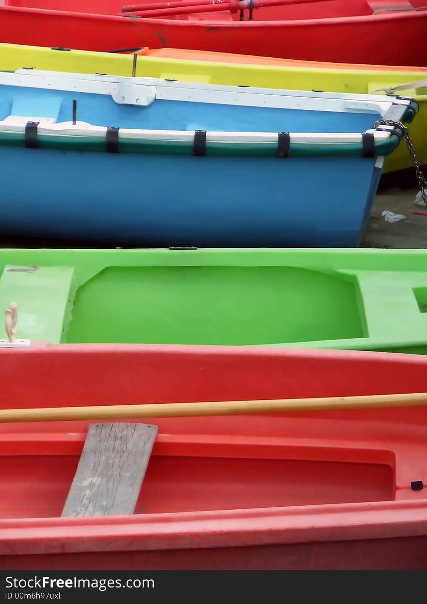 A view of colourful boats on a beach