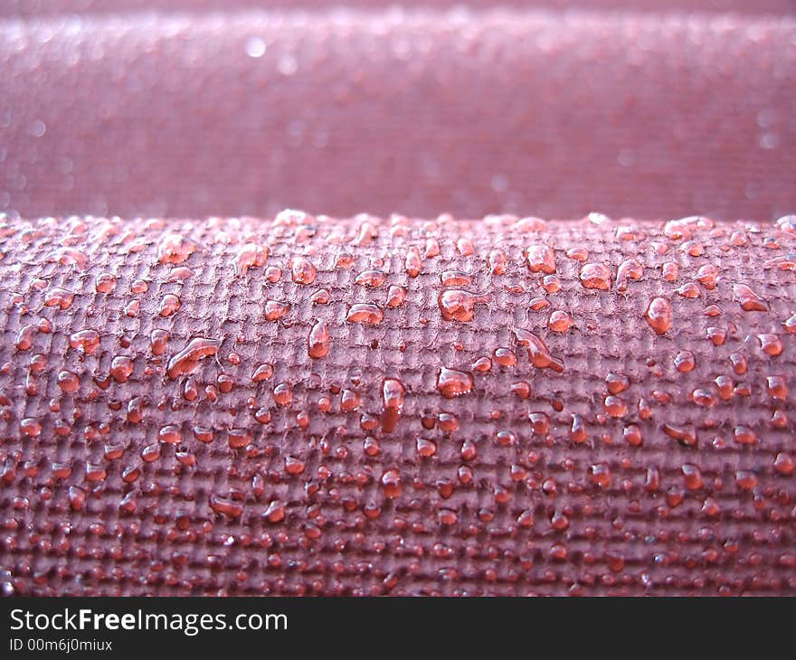 Droplets of water on a red roof after a rain. Droplets of water on a red roof after a rain