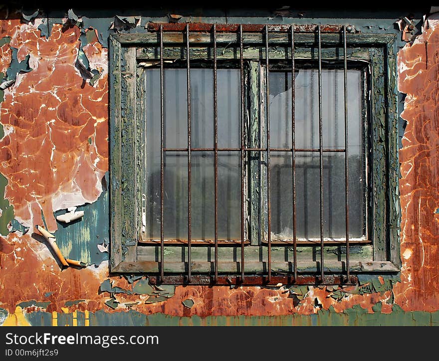 It is rust window of an old train. It is rust window of an old train.