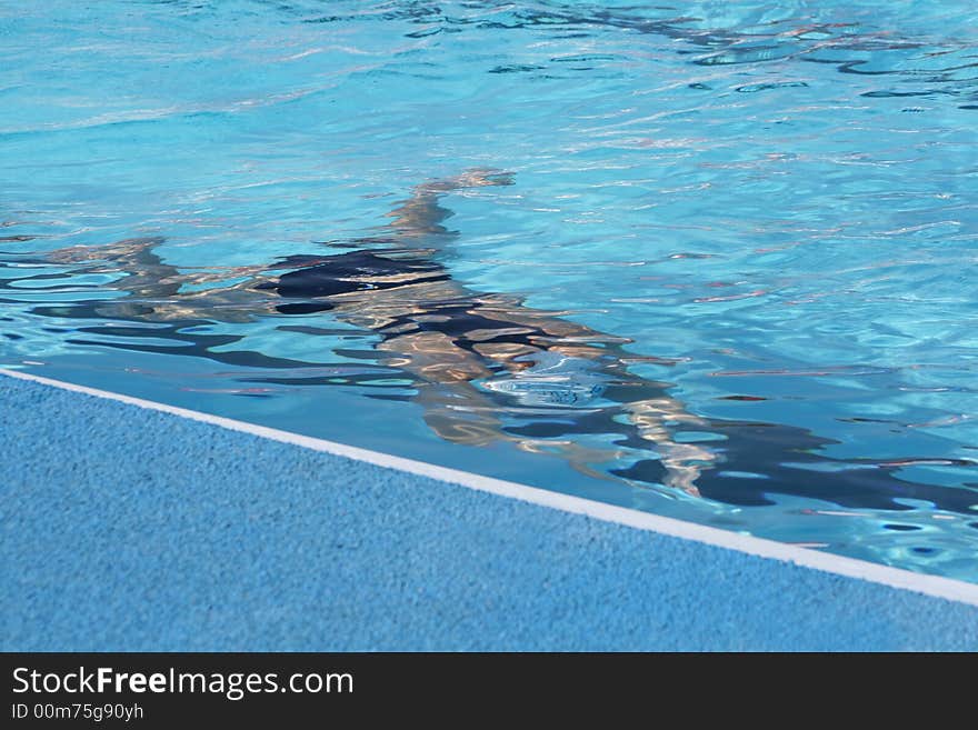 Figure of the sportsman in pool under water. Figure of the sportsman in pool under water