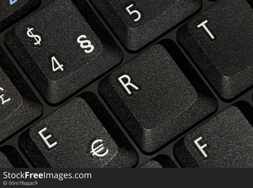 Black keyboard closeup with white letters