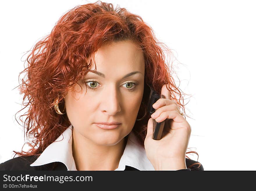 Attractive young redheaded woman calling by cellular phone  over white background