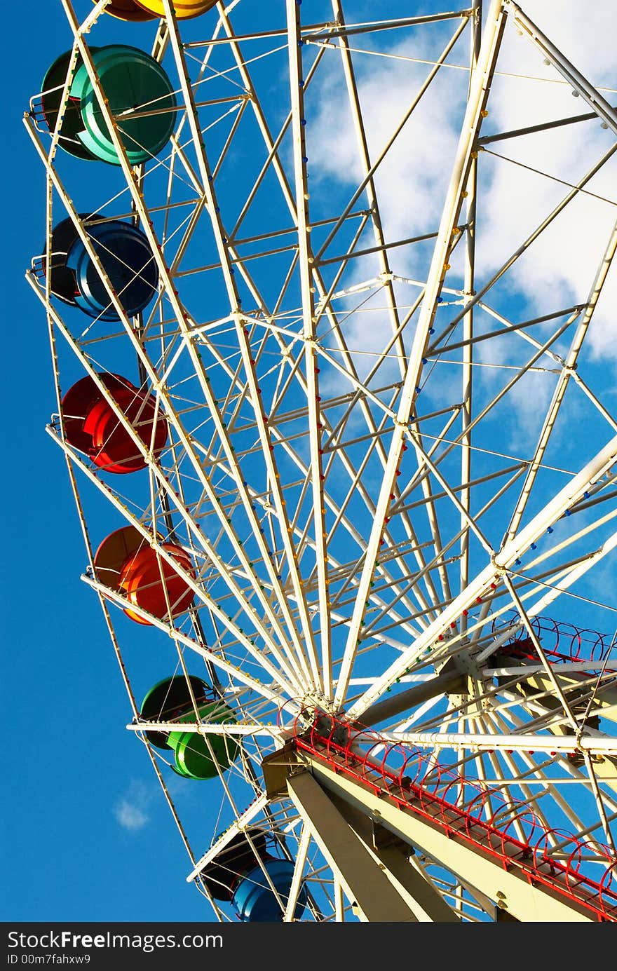 Carousel in the park against sky