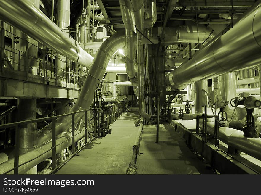 Different types of pipes and tanks inside energy plant. Different types of pipes and tanks inside energy plant