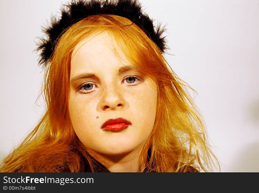 Young girl with black tiara on head. Young girl with black tiara on head