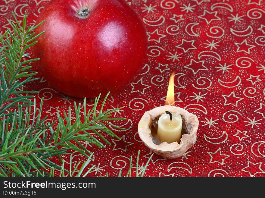 Christmas still life with apple and candle