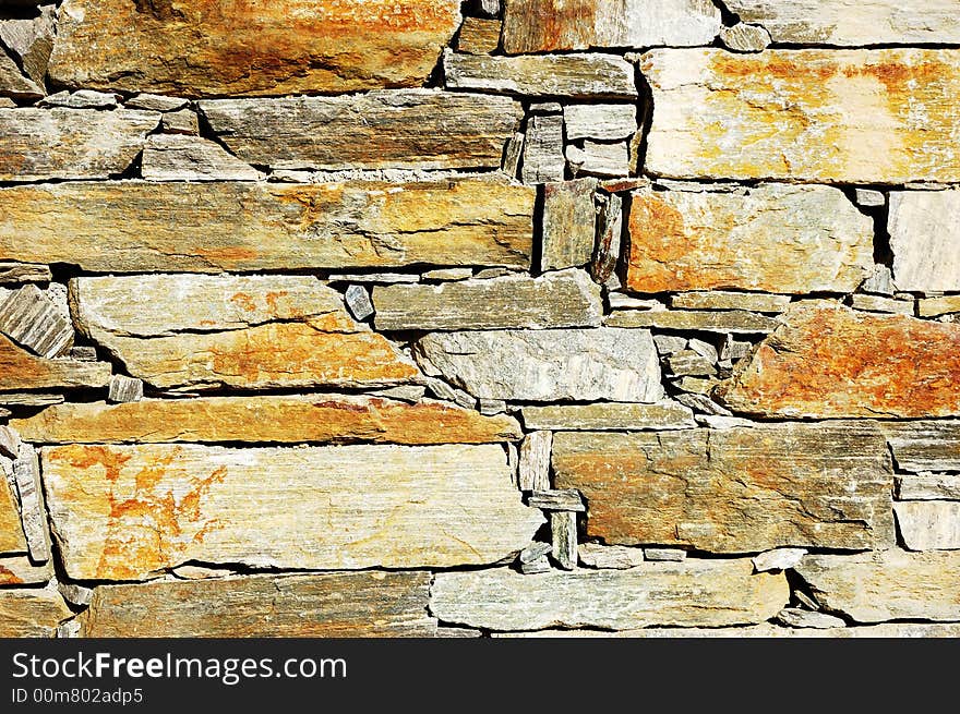 Detail of a colorful stone wall