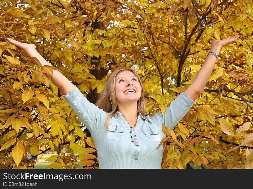 Blue-eyed blond among yellow leaves. Blue-eyed blond among yellow leaves