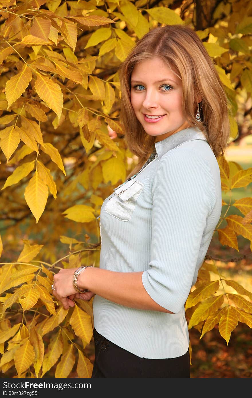 Blue-eyed blond in the park in autumn. Blue-eyed blond in the park in autumn