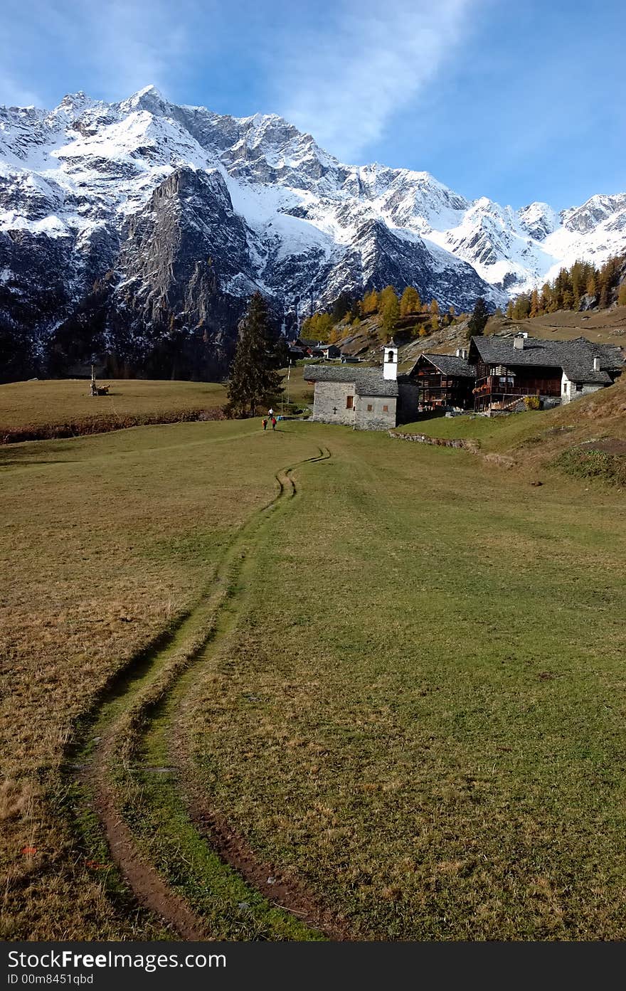 Mountain village during fall season; west Alps, Italy