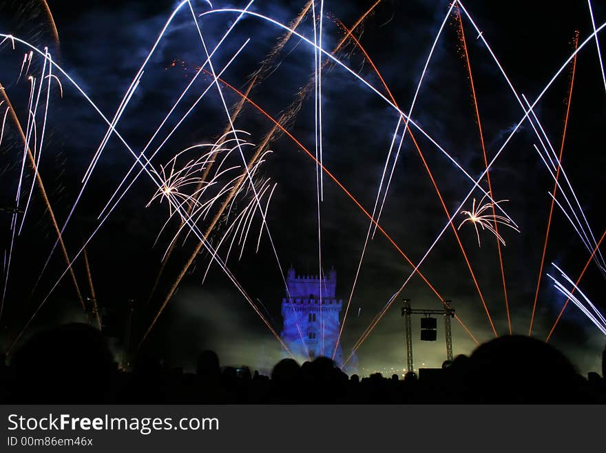 New year fireworks in the night in lisbon near tower belem, portugal