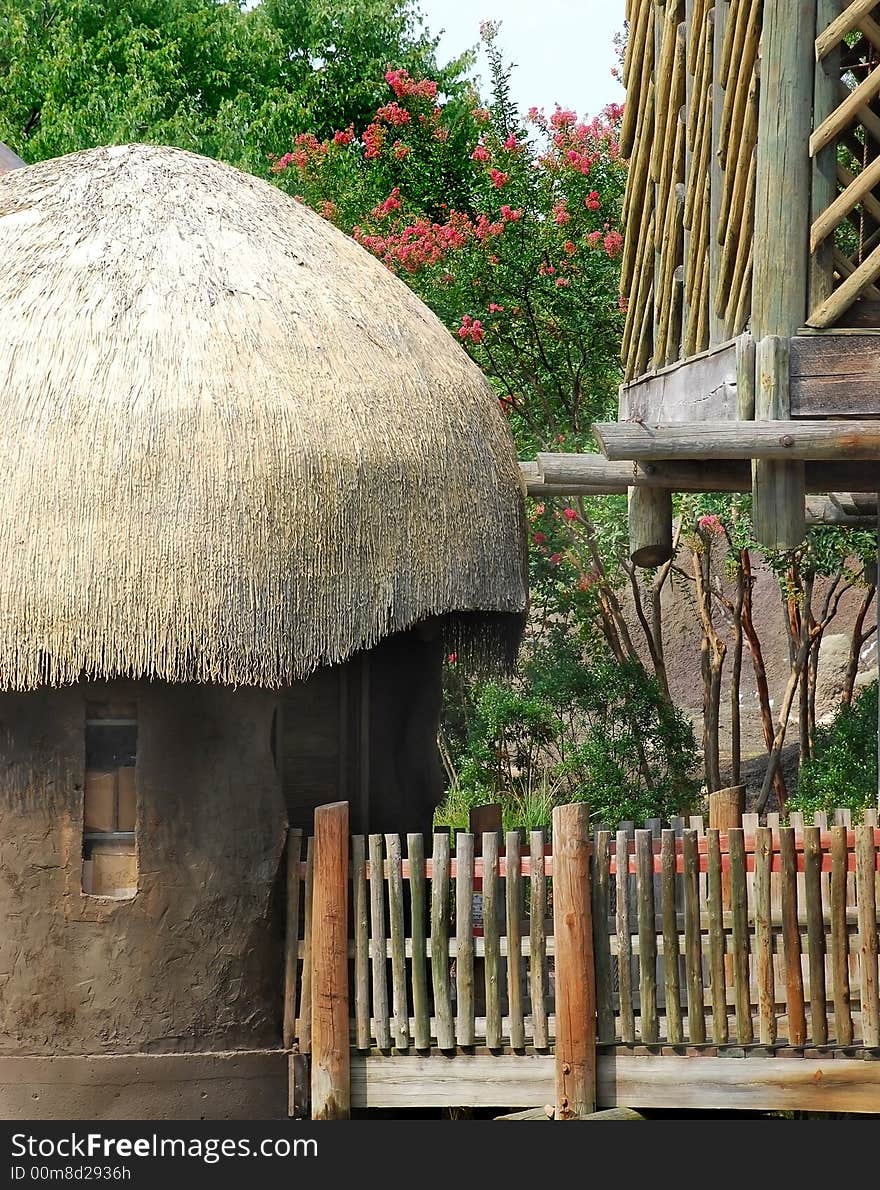 Native hut surrounded by modern decking. Native hut surrounded by modern decking