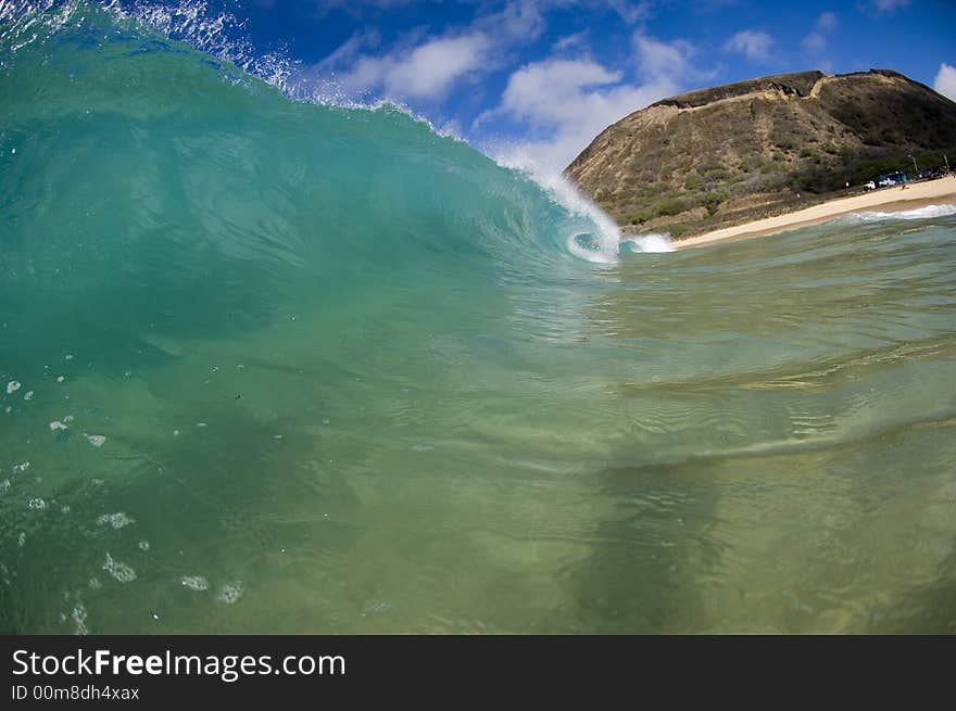 Giant wave breaking in shallow waters