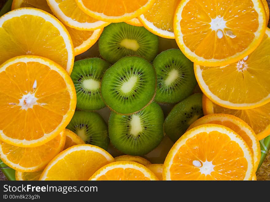 Kiwi and oranges slices. Daylight