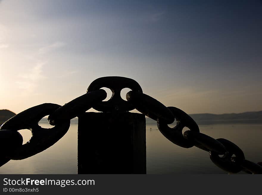 A big black chain with blue sky background