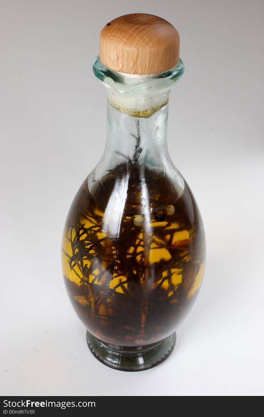 Bottle with spices in olive oil