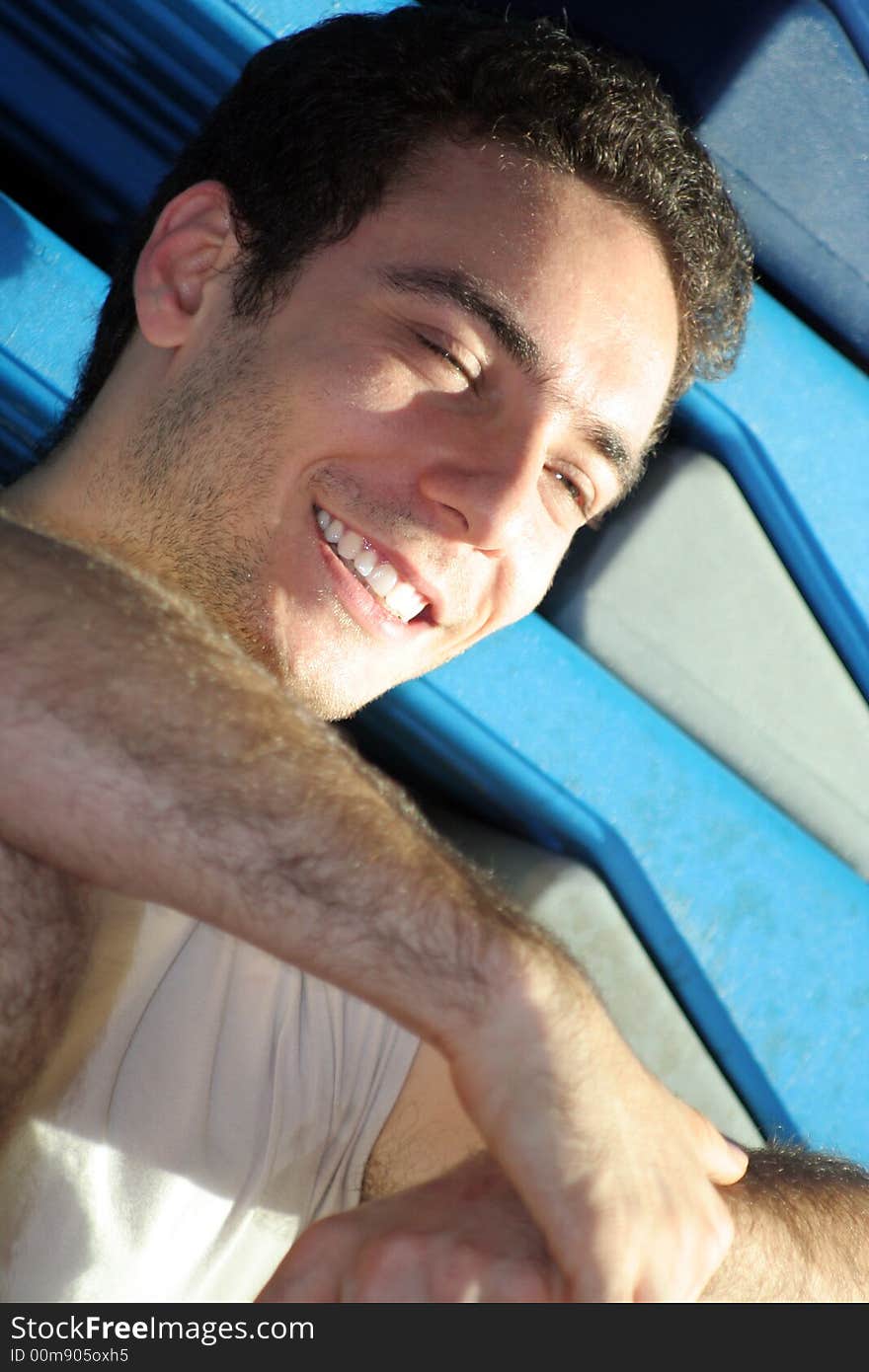 Smiling Boy with white teeth / With the steps behind / Indoor. Smiling Boy with white teeth / With the steps behind / Indoor