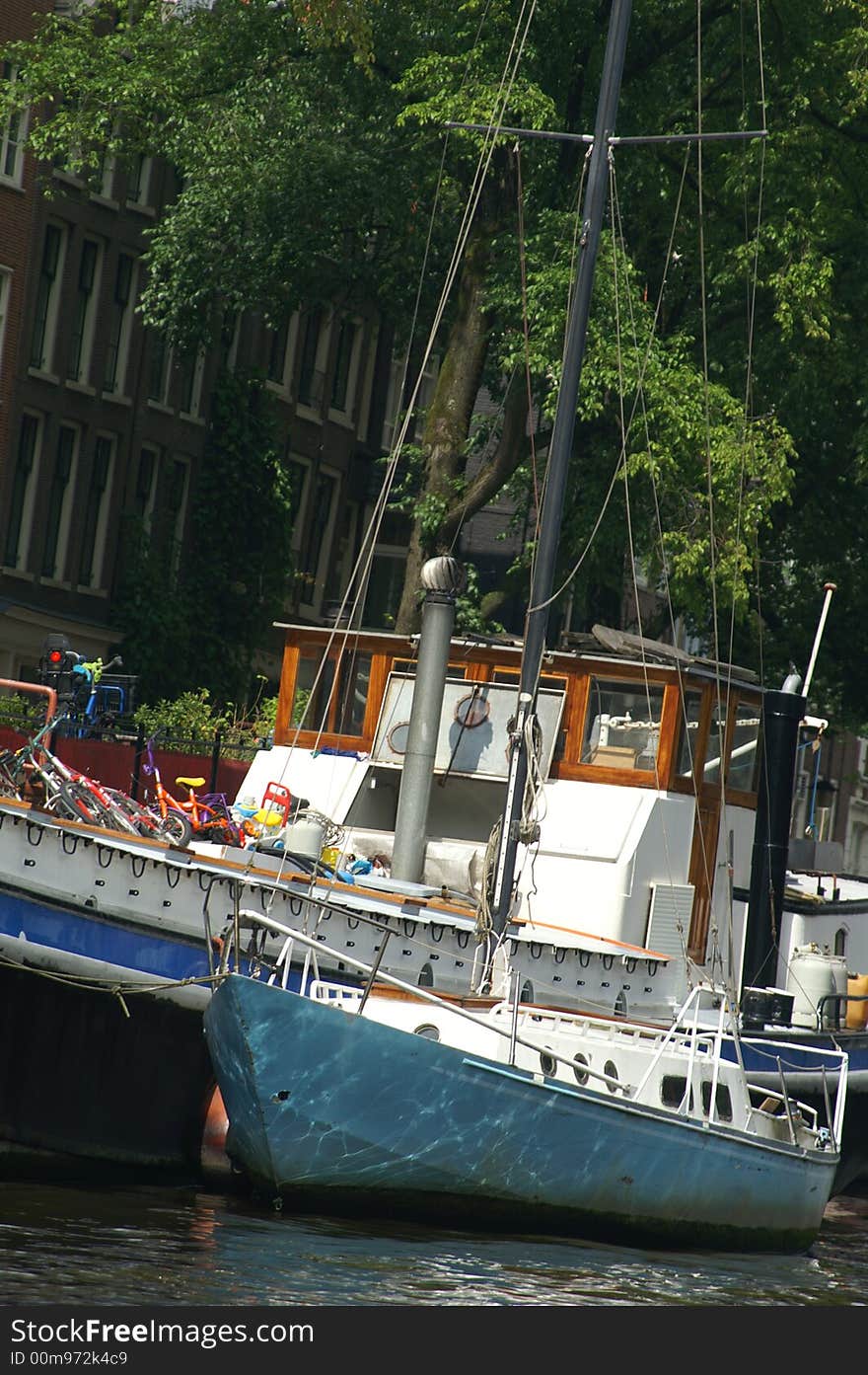 Amsterdam channel - boat travel on a river - europe vacation. Amsterdam channel - boat travel on a river - europe vacation