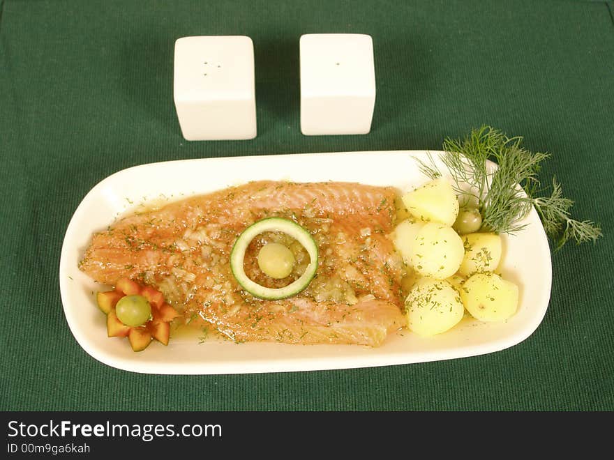 Salmon marinated in vinegar and served with potatoes. Salmon marinated in vinegar and served with potatoes