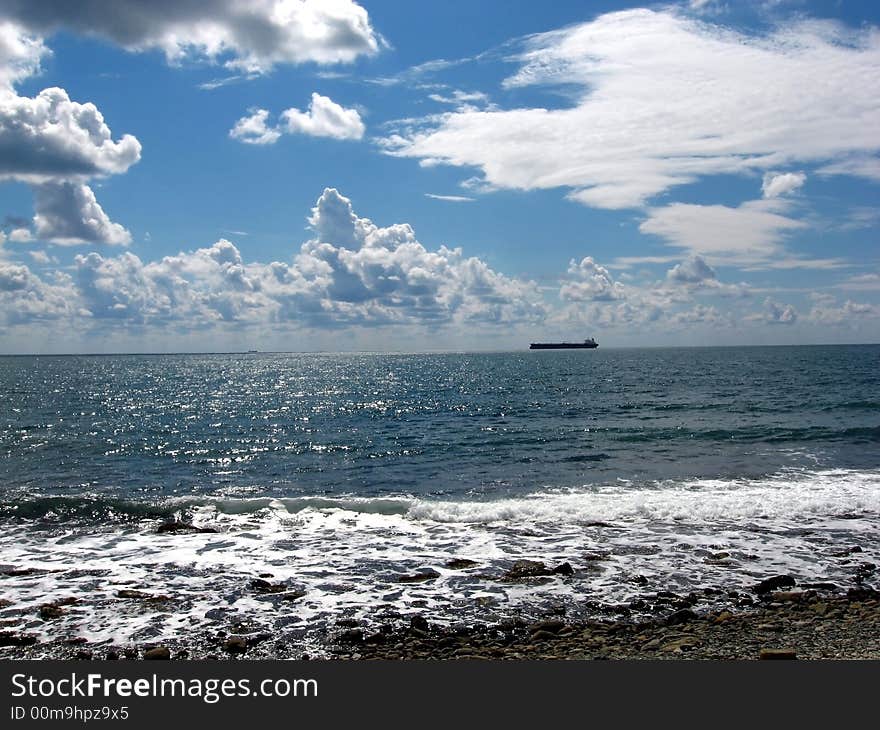 Black sea, seashore, cargo boat, clouds. Black sea, seashore, cargo boat, clouds