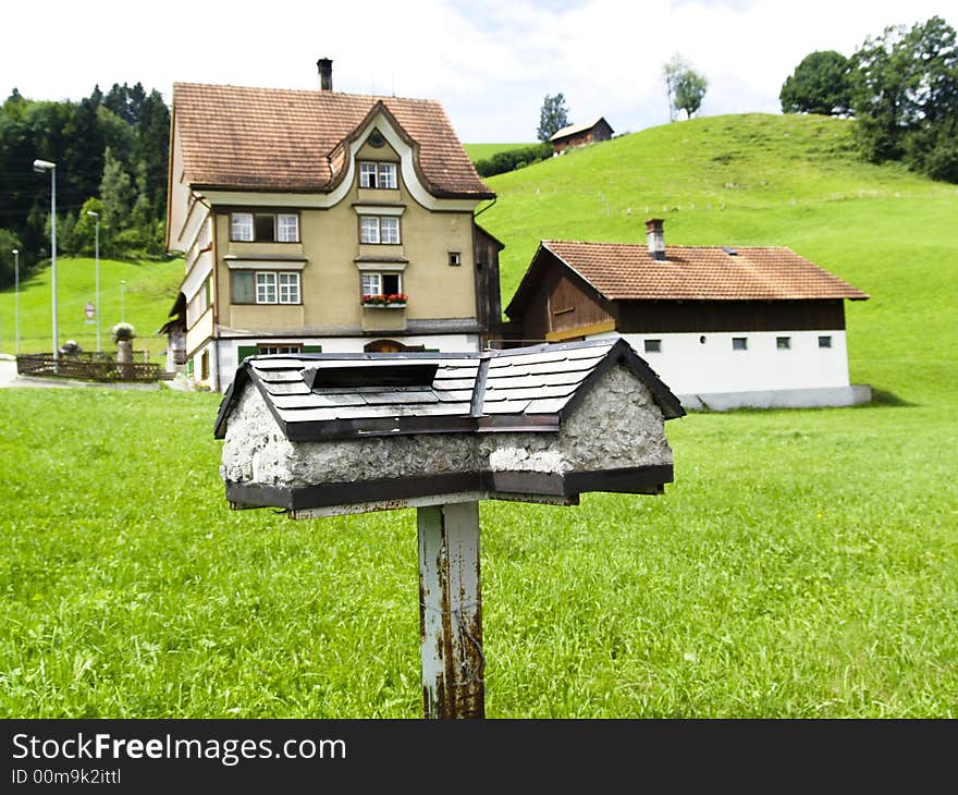 Beauty big mailbox in green garden - Alps