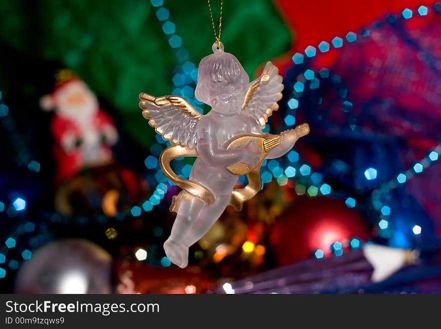 Angel with Christmas decoration and ornaments for a Christmas tree