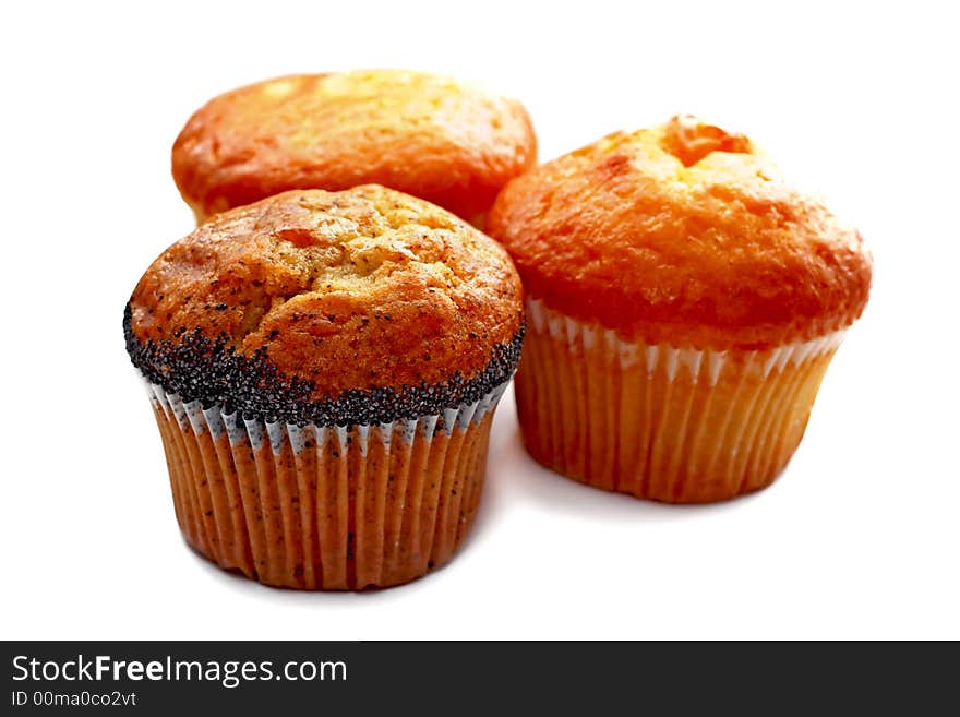 Three tasty muffins with poppies isolated on white background. Three tasty muffins with poppies isolated on white background