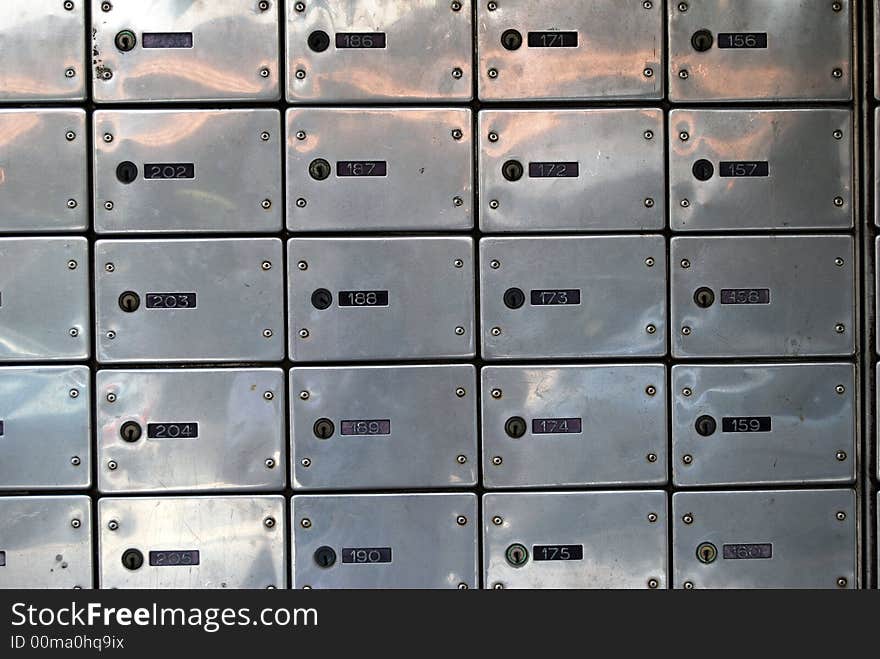 Close-up of letter-boxes in post office