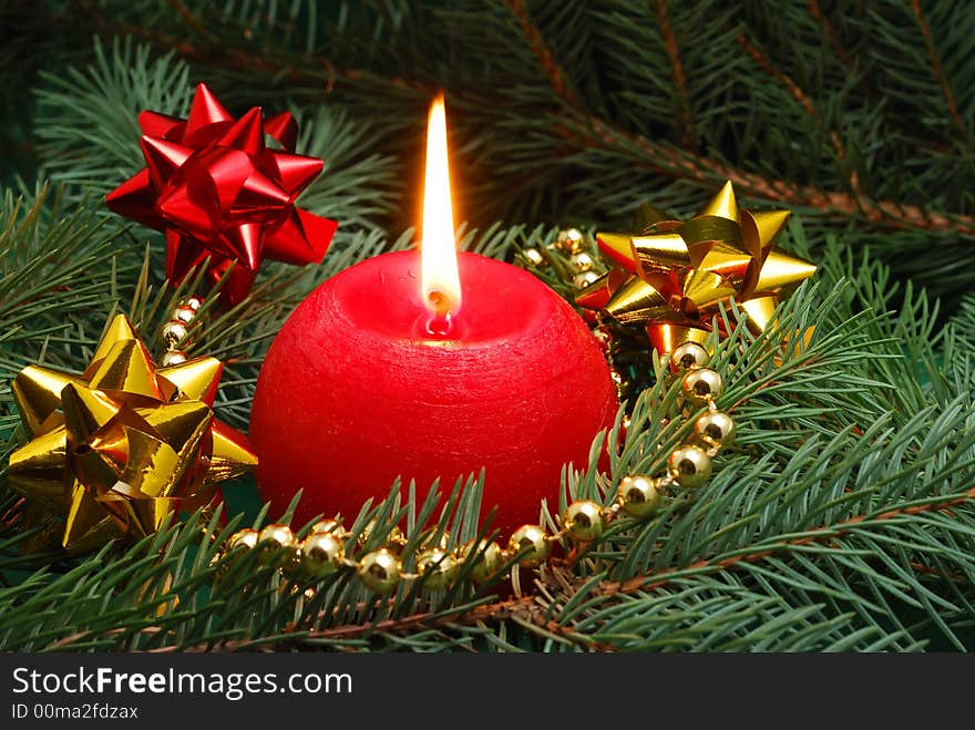 Red candle and christmas decorations. Red candle and christmas decorations