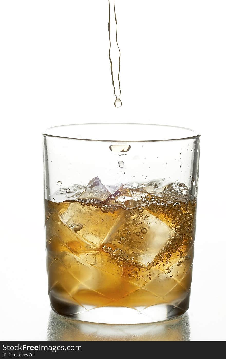 Glass with whiskey and ice