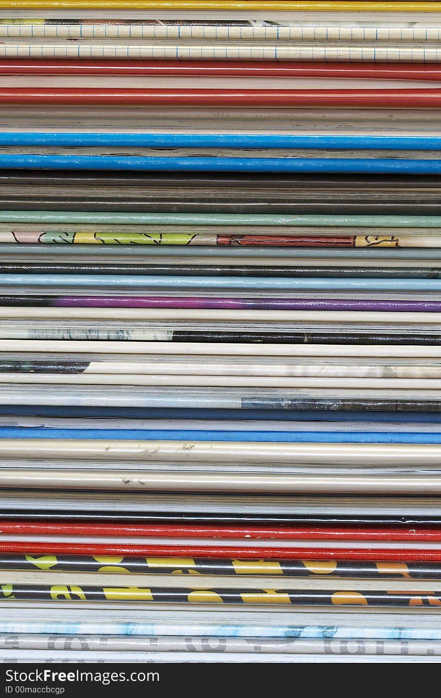 A lot of books stacked on a table. A lot of books stacked on a table