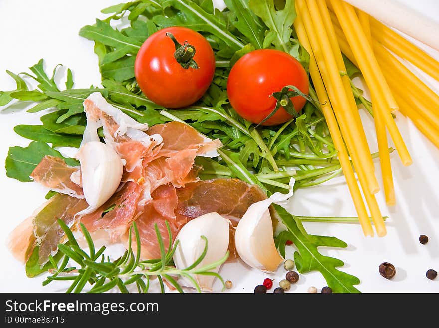 Pastaingredients on a wooden plate with spices. Pastaingredients on a wooden plate with spices