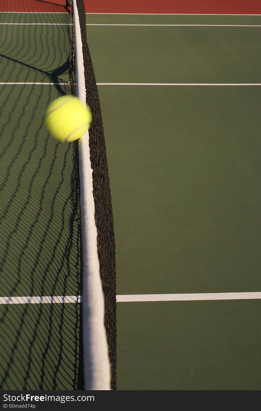 Tennis ball hitting net