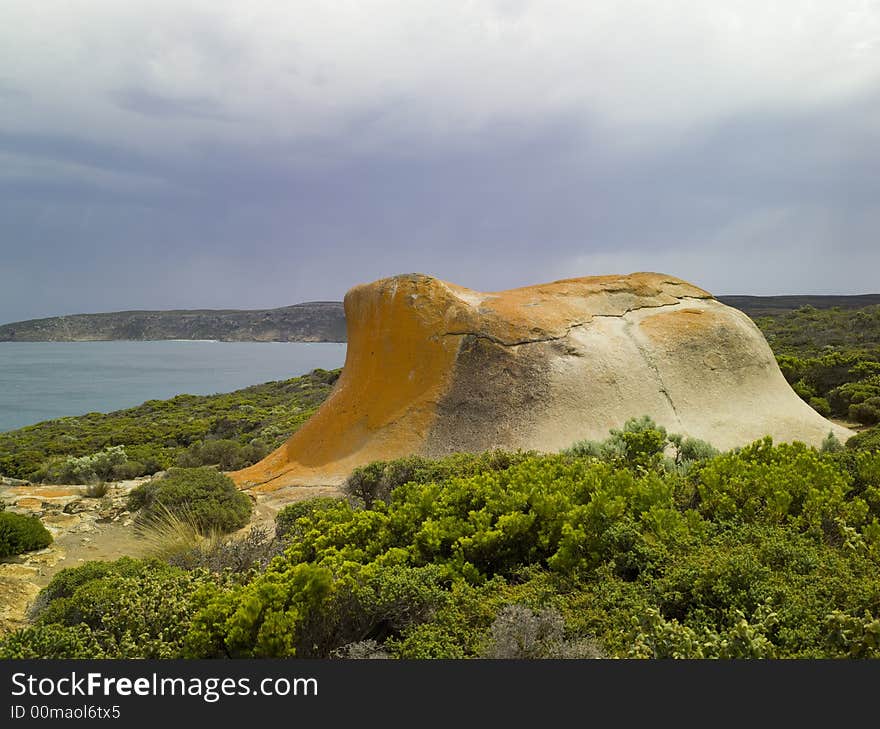 Dusk sets in on a cloudy day at Remarkable Rocks - a natural group of rock formations shaped by erosion of years of sand and surf hitting them. (South Australia)