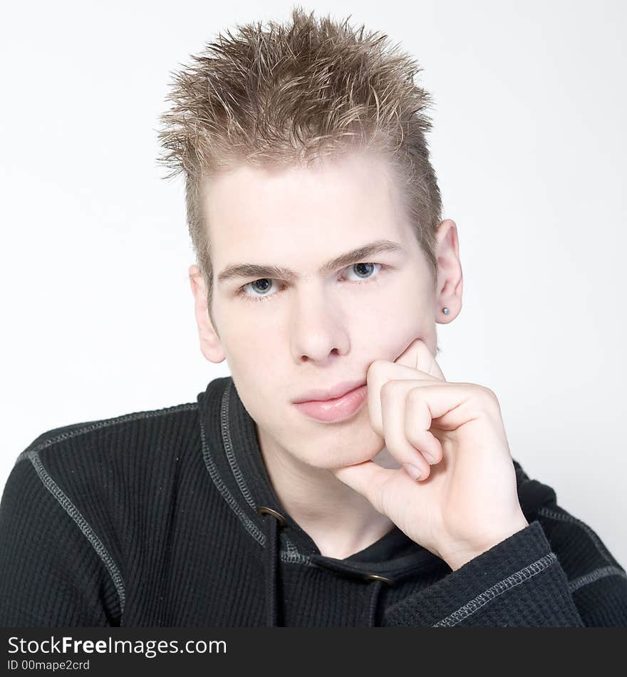 Couple of teenagers in the studio on a white background. Couple of teenagers in the studio on a white background