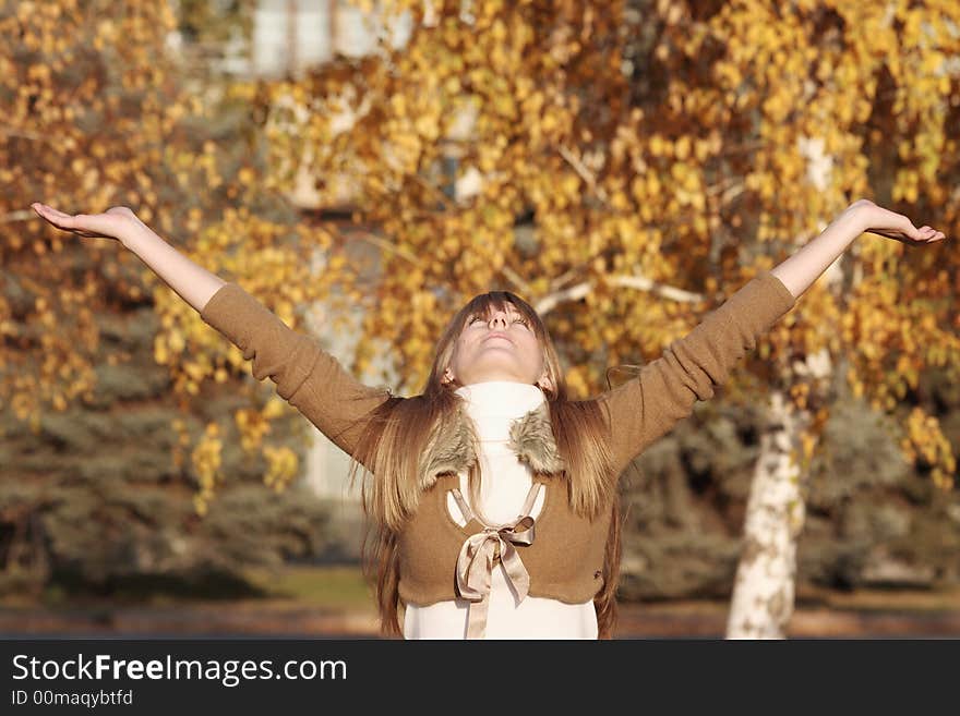 Portrait of a young girl raise hands up. Portrait of a young girl raise hands up