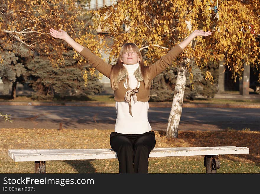 Portrait of a young girl raise hands up. Portrait of a young girl raise hands up