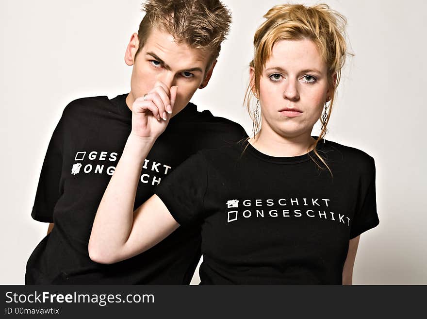 Couple of teenagers in the studio on a white background. Couple of teenagers in the studio on a white background