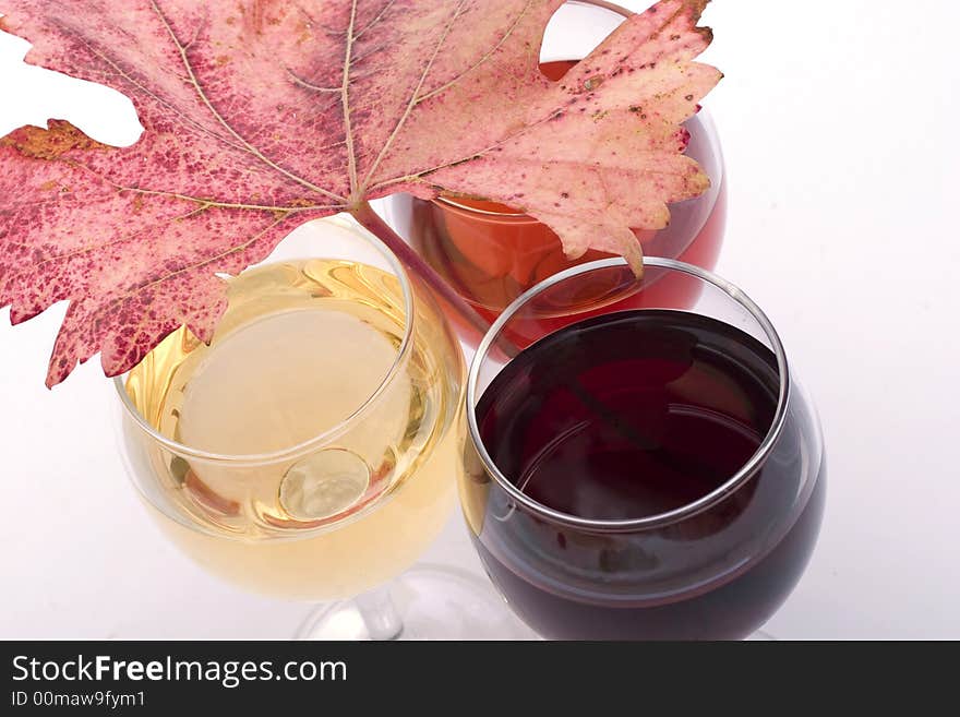 Three sorts of wine in glasses - red, rose and white