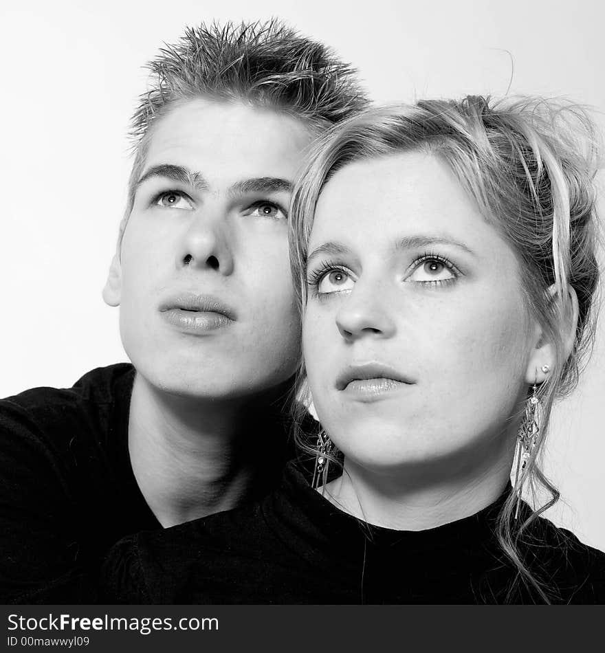 Couple of teenagers in the studio on a white background. Couple of teenagers in the studio on a white background