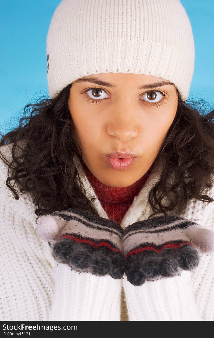 Winter girl in white isolated on blue background