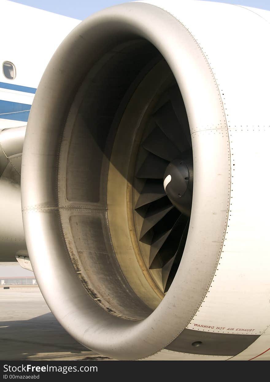 Turbine of an chinese aircraft waiting at the airport. Turbine of an chinese aircraft waiting at the airport