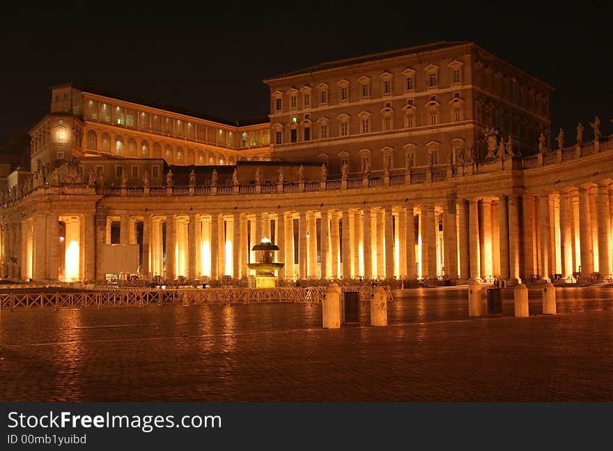 St. Peter's (Rome - Italy - Vatican City) House residence of the Pope at night / At the center is visible the building where the Pope sleep and preaches the Angelus on Sunday morning / St Peter's Square and Colonnade. St. Peter's (Rome - Italy - Vatican City) House residence of the Pope at night / At the center is visible the building where the Pope sleep and preaches the Angelus on Sunday morning / St Peter's Square and Colonnade