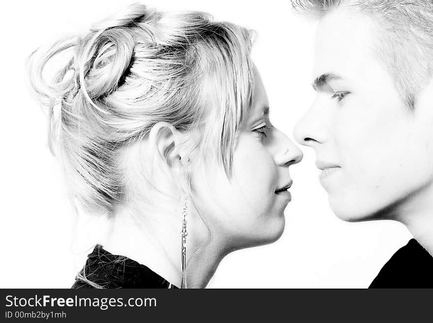 Couple of teenagers in the studio on a white background. Couple of teenagers in the studio on a white background