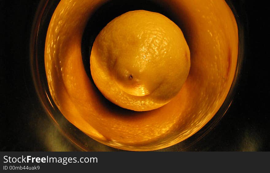 Lemon in trumpet in yellow light